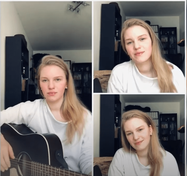 Frau im Bild singt mit Gitarre